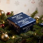 Wrapped present scene styled with kraft paper accents