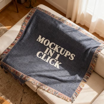 Styled woven blanket mockup draped on cozy sofa